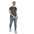 Man Standing Against Gray Background Wearing Dark Patterned T-shirt Blue Jeans White Sneakers with Reflection