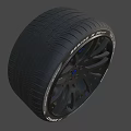 Black Car Tire With Stylish Alloy Rim And Spoke Design
