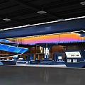 Modern Exhibition Booth With Blue Stylish Design Lighting Decor And Digital Display Screens