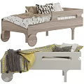 Wooden and White Kids Bed with Geometric Pattern Bedding and Wheel Design