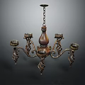 Vintage Ornate Metallic Chandelier With Curved Arms And Decorative Candle Holders
