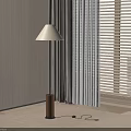 Modern Floor Lamp With White Lampshade And Brown Base Near Wooden Wall And Curtains