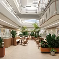 Floral Display Design In Shopping Mall Interior With Greenery Plants Tables And Chairs