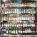 Assorted Bottled Beverages Displayed in Refrigerator with Various Flavors and Colors
