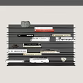 Stylish Black Layered Wall Shelf Displaying Books Magazines and Decorative Stone