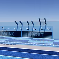 Modern Outdoor Recreational Area With Blue Green Track Railings And Signage