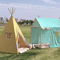 Outdoor Campsite With Yellow Teepee Tent And Light Blue Cabin Style Tent On Green Lawn