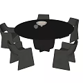 Modern Dark Round Dining Table with Four Chairs and Tabletop Bowl Decor 3d model