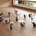Different Types of Caster Wheels Displayed on Wooden Table with Natural Light