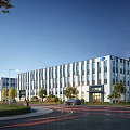 Modern Industrial Factory Building Exterior With Greenery Trees Road And Vehicles Under Clear Sky