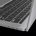 Sleek MacBook Pro Laptop With Silver Body And Wave Landscape Screen Modern Design