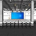Modern Conference Room With White Folding Chairs Large Blue Screen Hanging Lights and Concrete Pillars