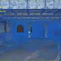 Modern Urban Underpass With Arched Tunnels Graffiti Covered Brick Walls And Paved Road