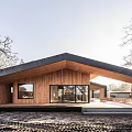 Modern Detached House With Wooden Exterior Black Roof Large Windows And Natural Surroundings