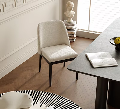 Modern Beige Upholstered Dining Chair With Black Wooden Legs By Dining Table And Books 3d model