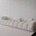 Cream Colored Large Sofa With Plush Cushions In Minimalist Living Room Interior