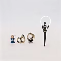 Decorative Ornament Set with Blue Angel Golden Ring Spiral Ornaments and Black Halo Holding Figure