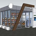 Modern Glass Building With Bookshelves Chairs Flowers And Water Dispenser