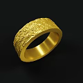 Exquisite Golden Ring With Intricate Textured Surface And Sleek Band Design