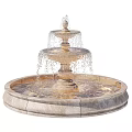 Elegant Three Tiered Stone Fountain With Cascading Water And Circular Basin