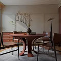 Round Wooden Dining Table With Brown Leather Chairs And Vase On Gray Rug