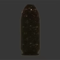 Two Shiny Brass Bullets With Copper Tips Lying On Reflective Dark Surface