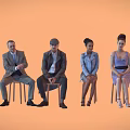 Group of diverse people sitting on chairs arranged in a row against orange background