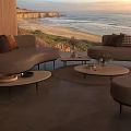 Outdoor Sofa with Coastal Ocean View at Sunset and Modern Coffee Table Decor