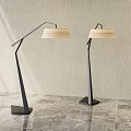Modern Floor Lamps With Black Metal Poles And Light Striped Shades On Marble Floor