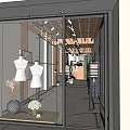 Modern Clothing Store Interior With Black Metal Frames White Walls Art Paintings And Green Plants