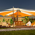 Orange And White Canopy Tent With Outdoor Bar Counter Plants And Chairs On Wooden Deck