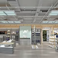 Well Lit Modern Fashion Store Interior With Clothing Racks And Bag Displays 3d model