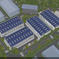 Modern Industrial Factory Complex With Blue Roof Multiple Buildings Greenery And Parking Area