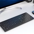 Modern Desktop Computer Setup With Large Monitor RGB PC Case Keyboard Mouse And Speakers