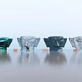 Large Head Sculpture Carvings Featuring Blue Gray Colors Person Standing Orange Chairs and Ground Reflection