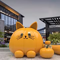 Giant Pumpkin Cat Sculpture At Modern Shopping Mall With Small Pumpkins And Greenery