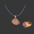Gold Jewelry Set With Intricate Pendant Necklace And Detailed Ring Design