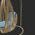 Wicker Hanging Chair With Blue Cushion And Woven Frame Structure