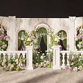 Elegant Floral Display With White Columns Green Curtains And Arched Structures 3d model