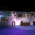 Display Shelves In Modern Exhibition Featuring Artwork Illuminated Cases Wooden Structure And Purple Carpeted Floor