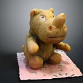 Brown Rhino Stuffed Doll Sitting On Pink Patterned Mat With Soft Texture 3d model