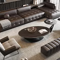 Modern Brown Leather Sectional Sofa With Round Wooden Coffee Table And Accent Chairs On Area Rug