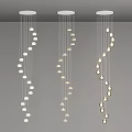Three Modern Chandeliers With Sleek Hanging Light Fixtures And Spiral Bulb Arrangement