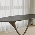 Elegant Black Oval Dining Table With Unique Curved Base And White Curtains On Wooden Floor