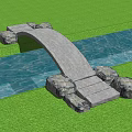 Natural Stone Arch Bridge Over Water With Green Grass And Stone Base