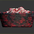 Red and white striped candy arranged in red and black woven basket