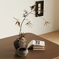 Decorative Ornament Set Including Vase Leafy Branches Open Book Stacked Books Small Bowl On Table