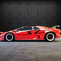 Red Sports Car With Sleek Aerodynamic Body And Rear Spoiler On Gray Floor