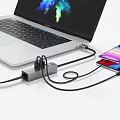 Laptop and Smartphone Connected via Multi Port USB C Hub for Digital Device Charging