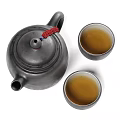 Black Tea Set with Red Tassel Decorated Teapot and Two Black Teacups Filled With Tea
